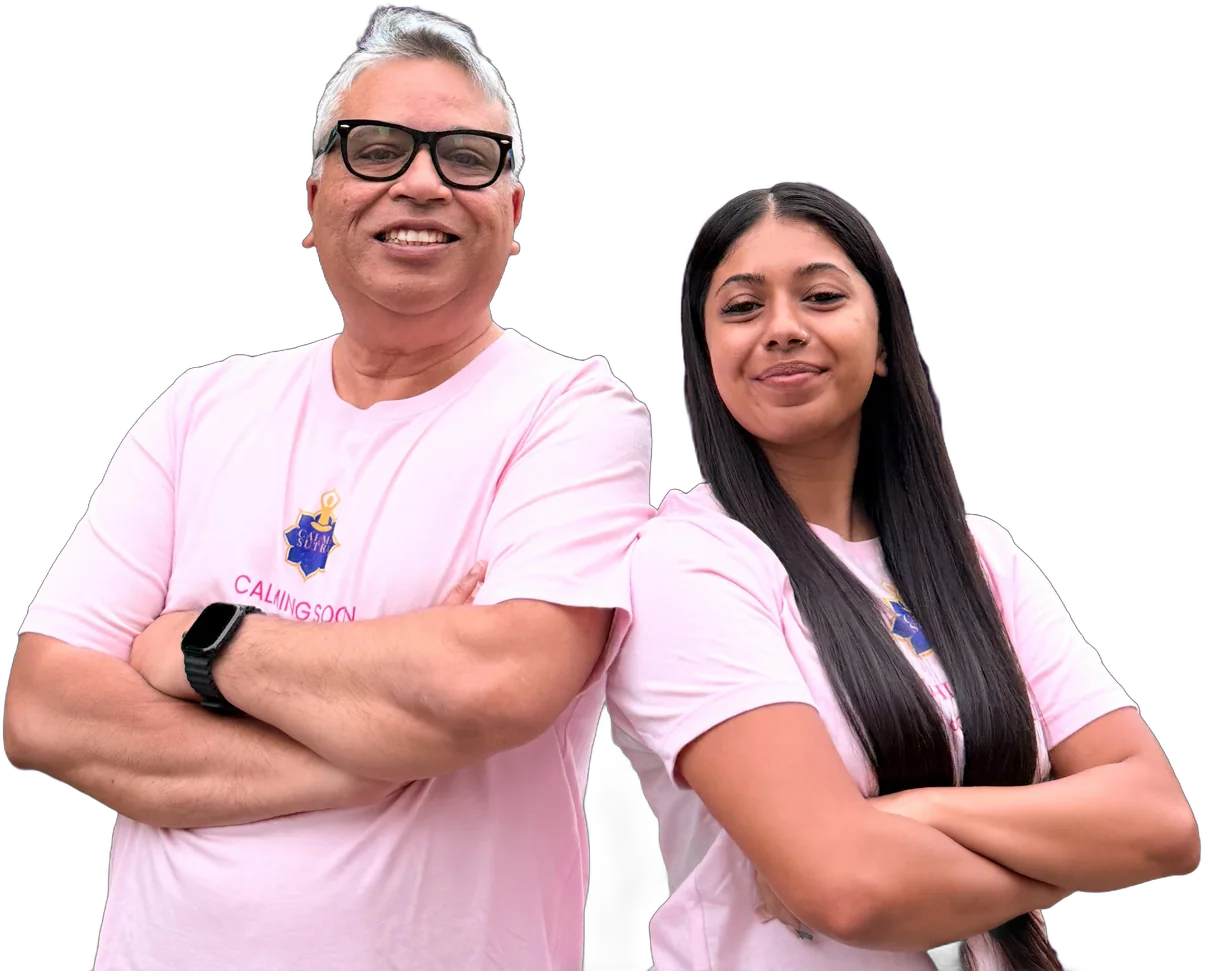 Neil and Chanel Christy side by side in pink Calma Sutra shirts, arms crossed, smiling