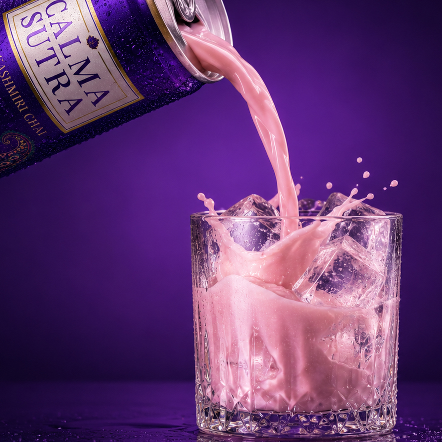 A Calma Sutra purple can pouring pink Kashmiri chai over ice